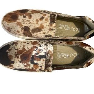 Corkys Boutique slip on cow hide shoes.